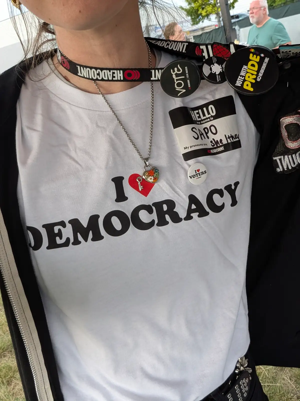 Volunteer wearing an I love democracy tshirt with lanyard